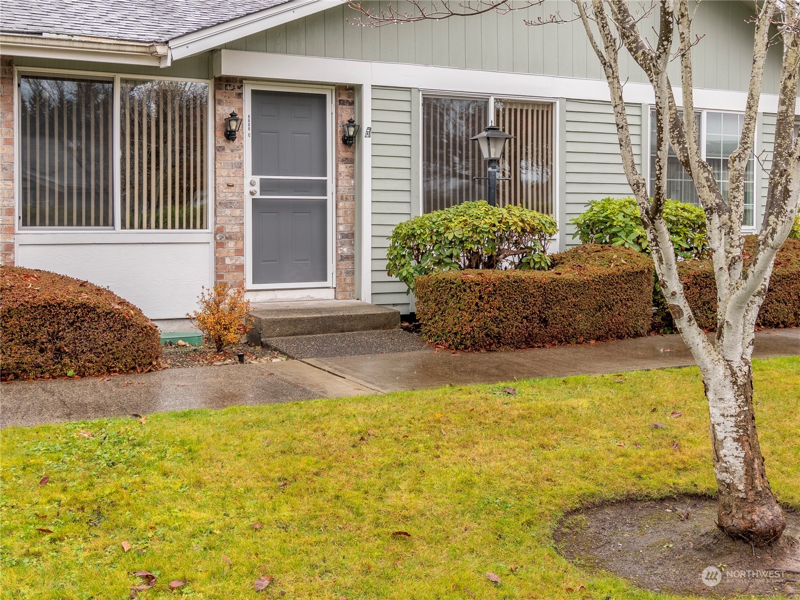 a front view of a house with a yard