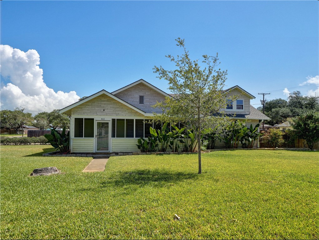 a front view of a house with a yard