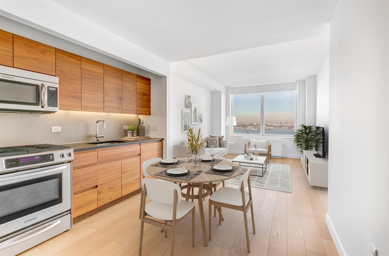 a kitchen with a table chairs stove and microwave