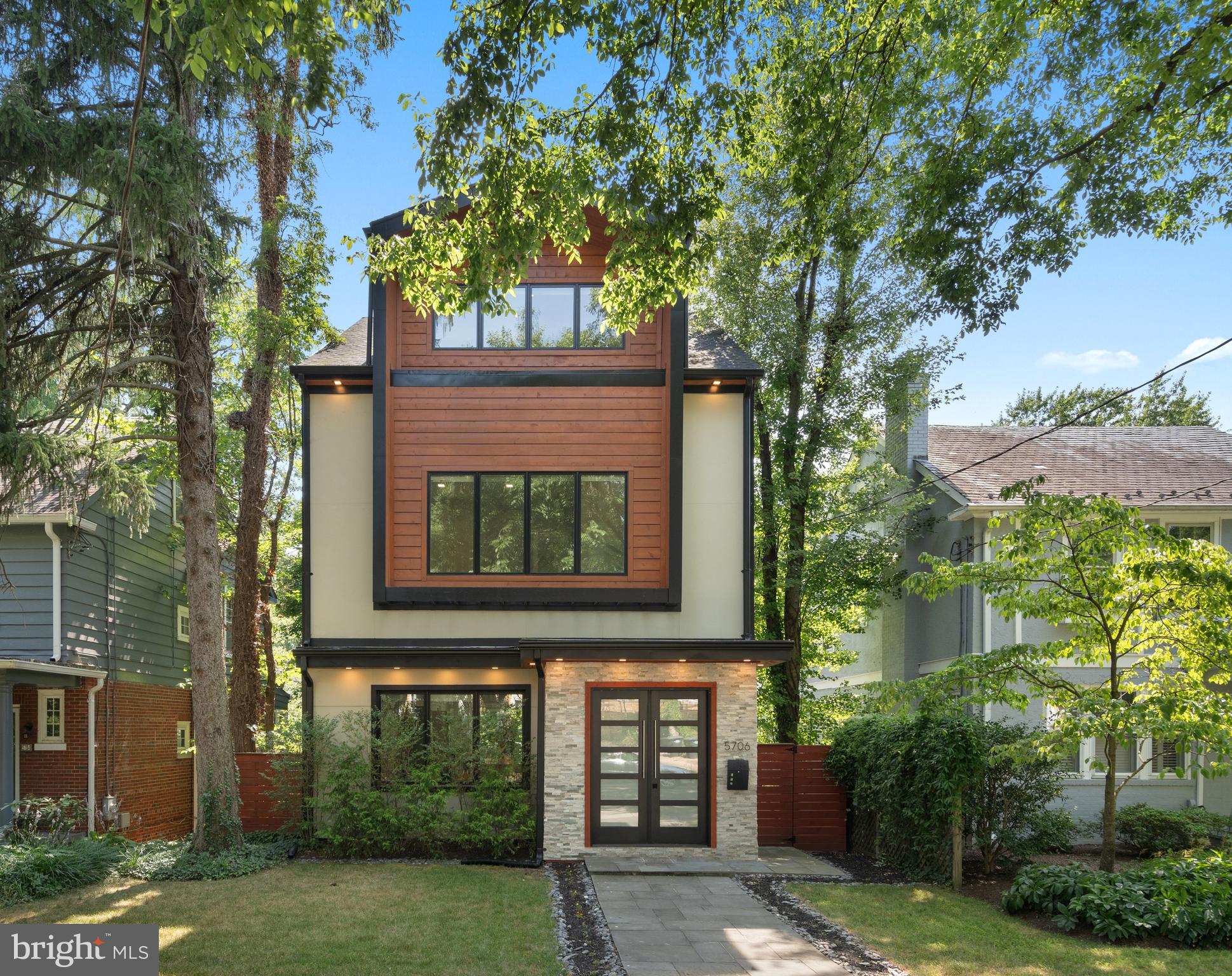 front view of a house with a tree