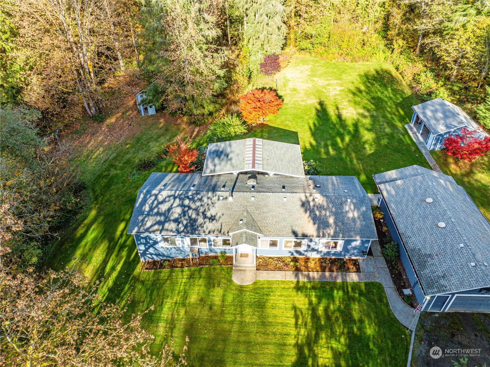 a view of a swimming pool with a yard