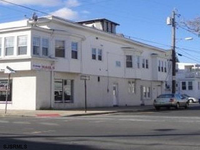 a view of a building along a street