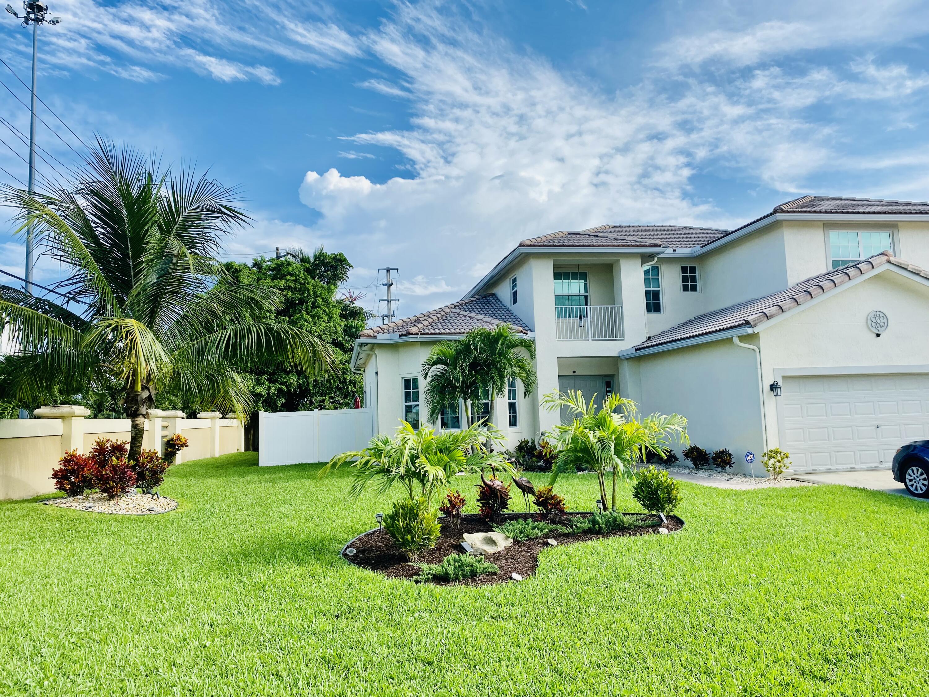 a front view of house with yard and outdoor seating