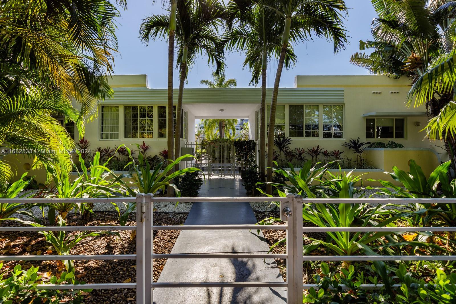 front view of a house with a potted plant