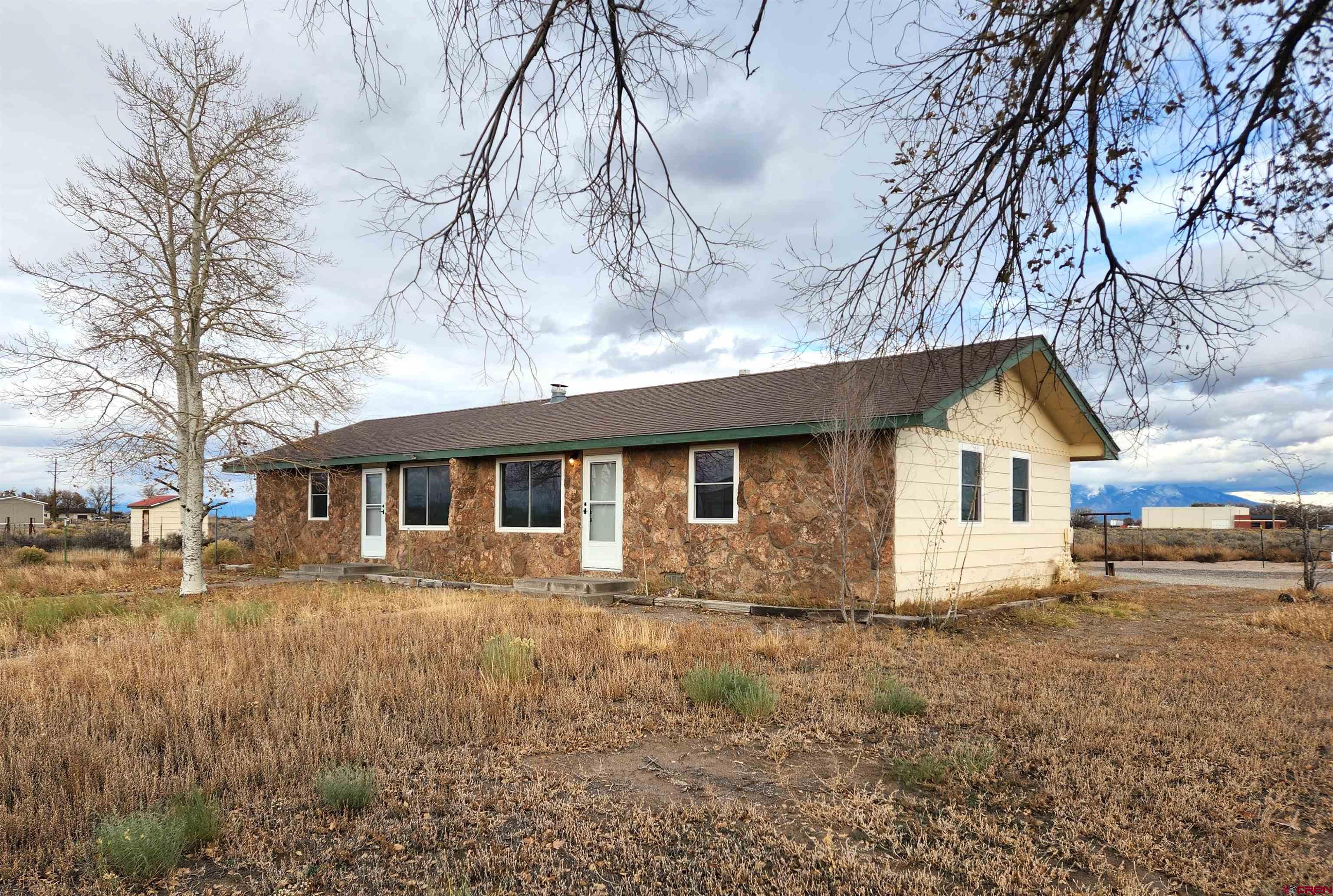 a house with trees in the background