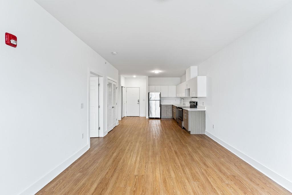 a view of kitchen with wooden floor