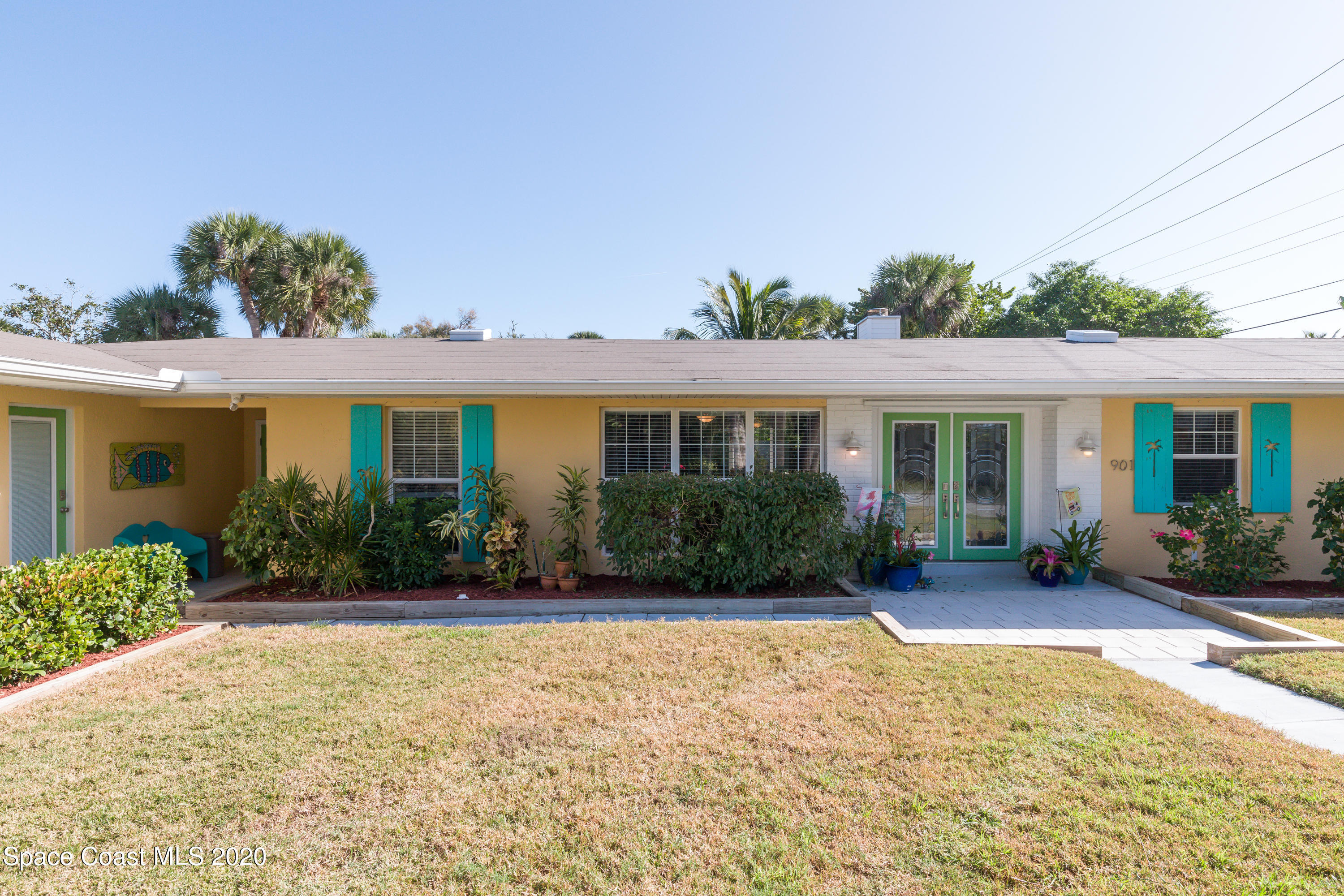 front view of a house with a yard