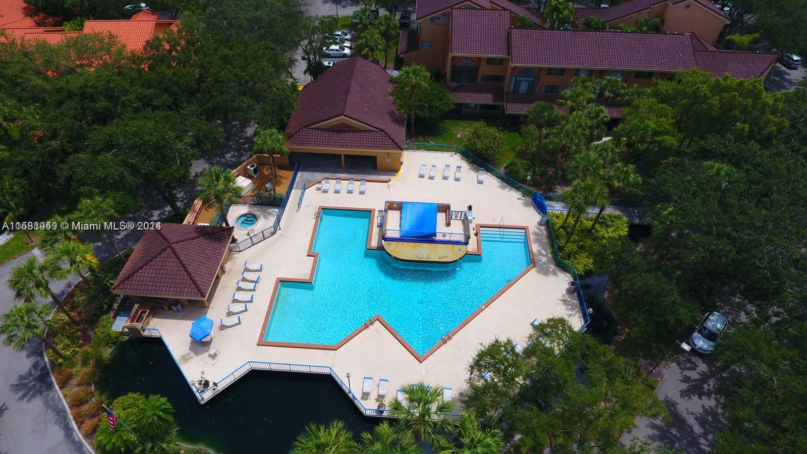 an aerial view of a house with garden space and street view