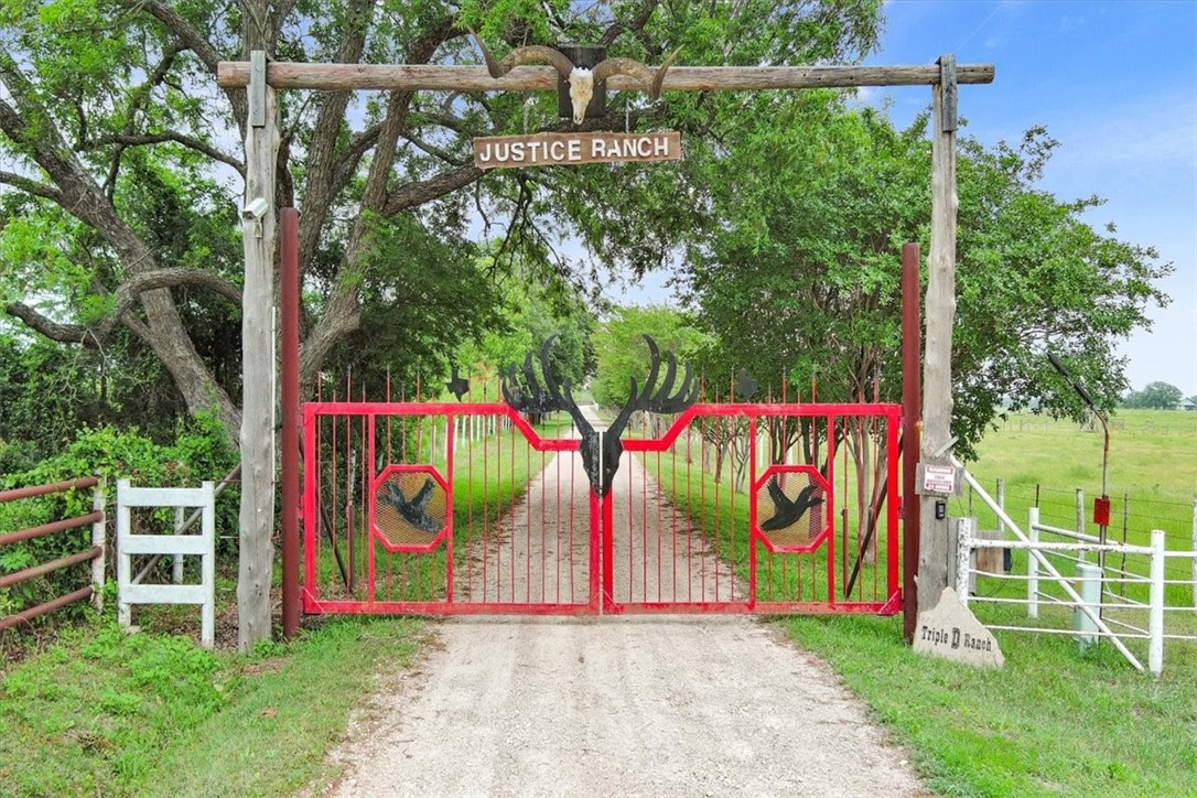 a view of park with sign board and yard