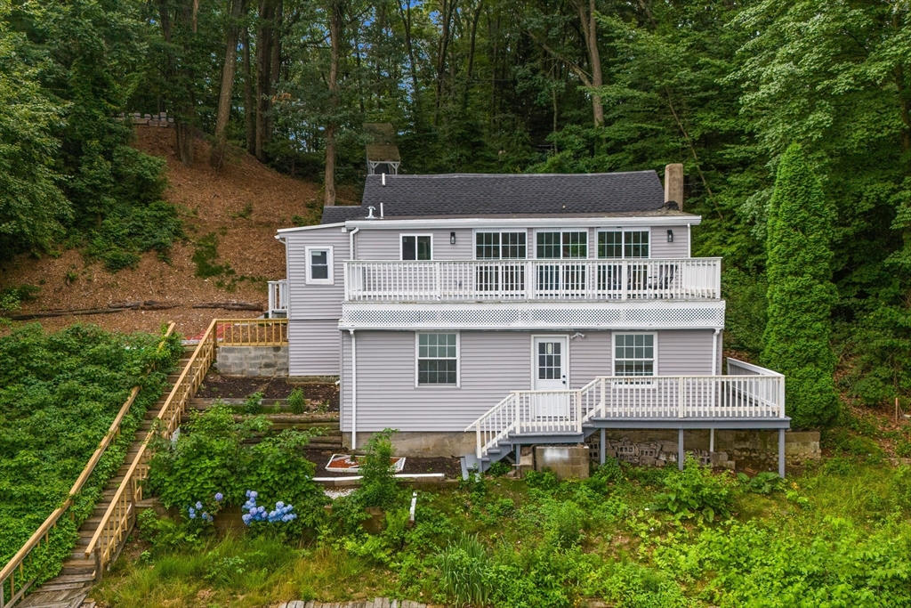 a aerial view of a house with a yard