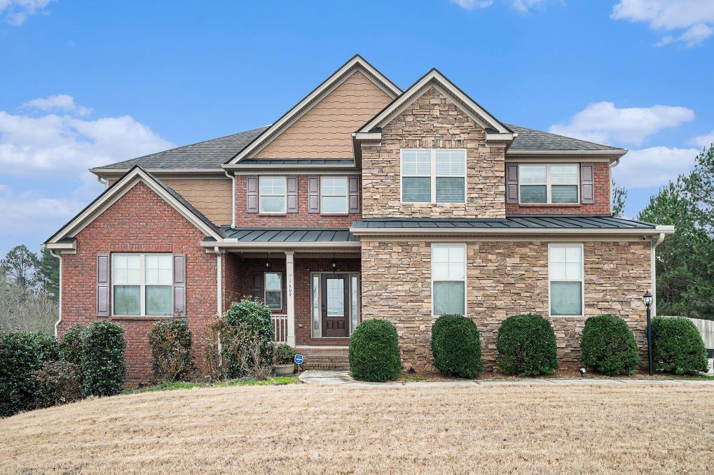 a front view of a house with a yard