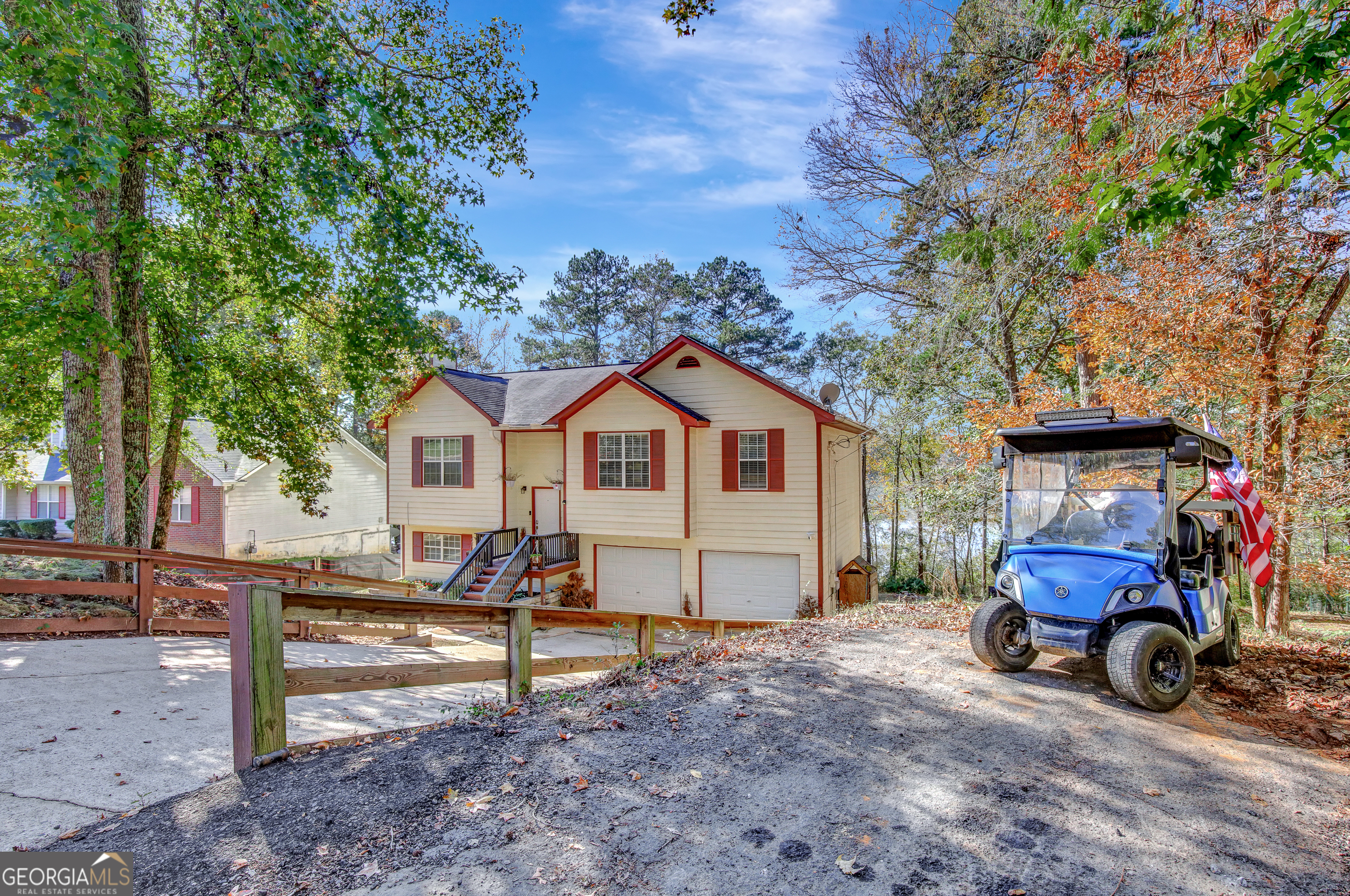 a view of house with outdoor seating area