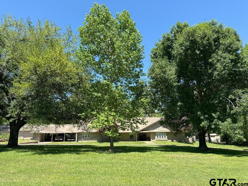 a view of a house with a big yard