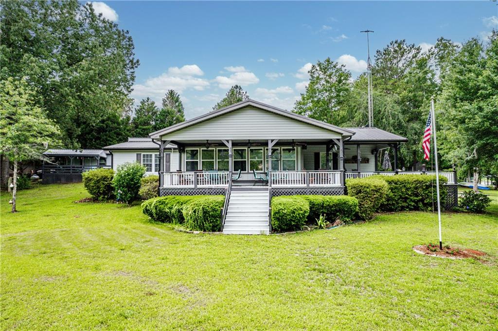 a front view of a house with garden