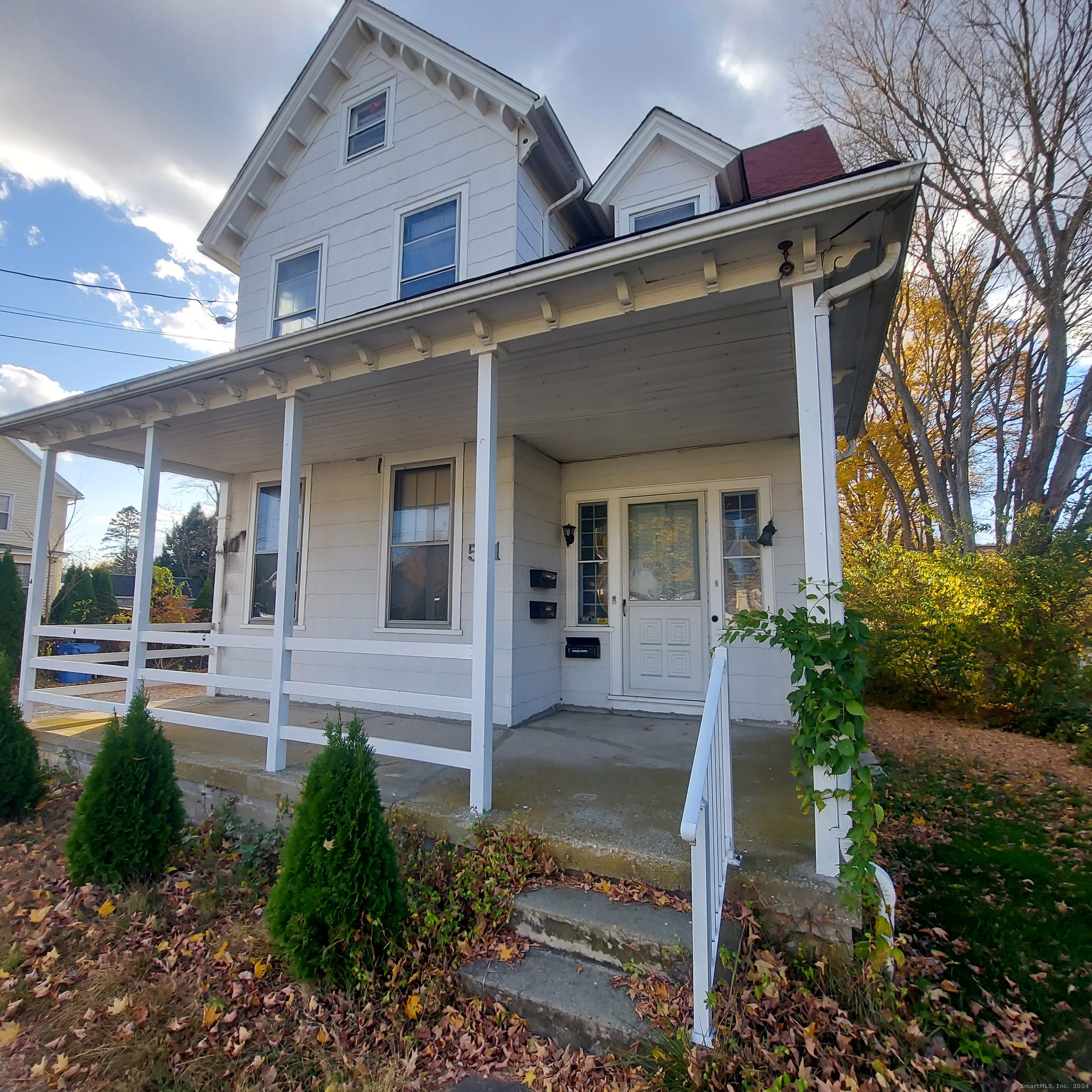 front view of a house with a yard