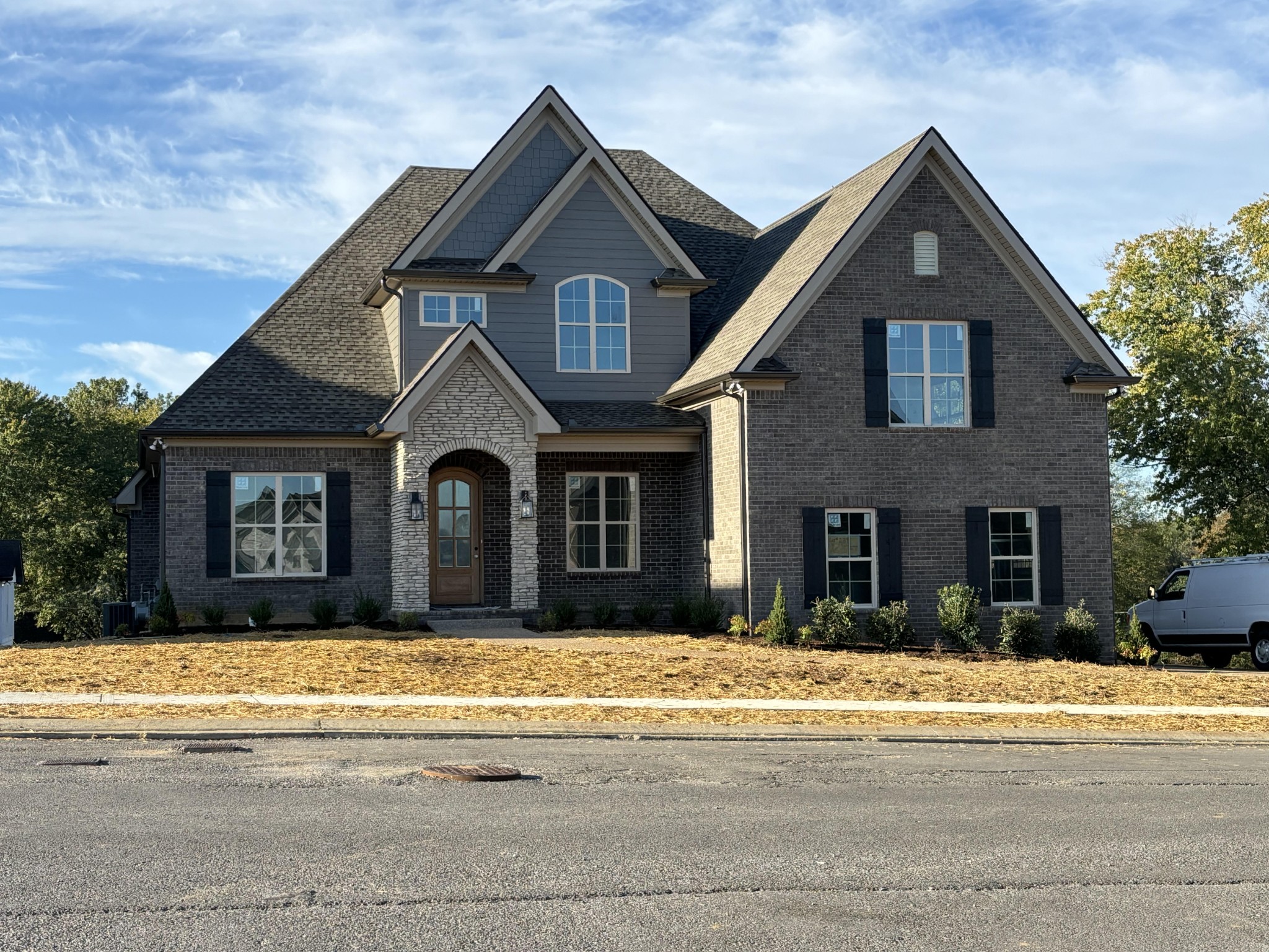 a front view of a house with a yard