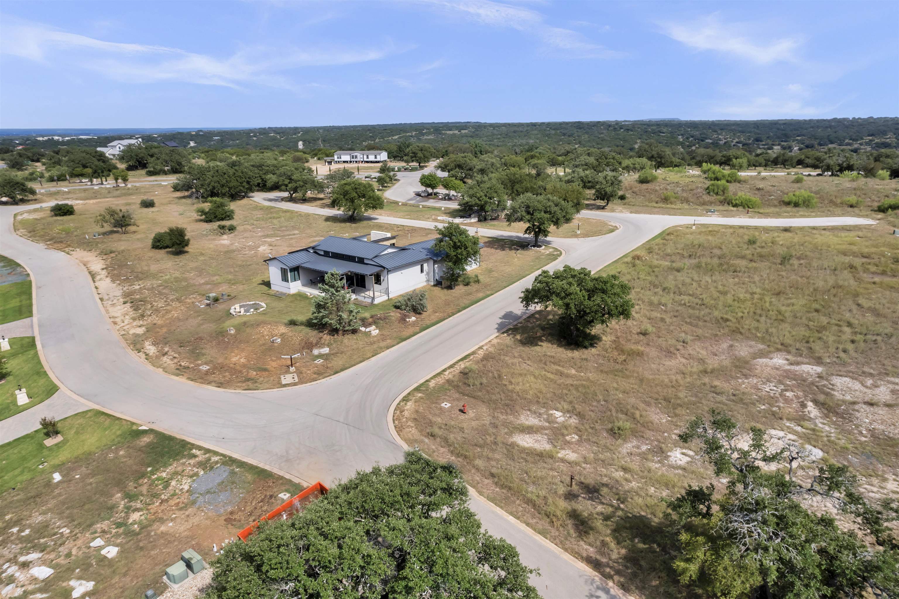 an aerial view of residential houses with outdoor space