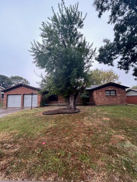 a large tree in front of a house