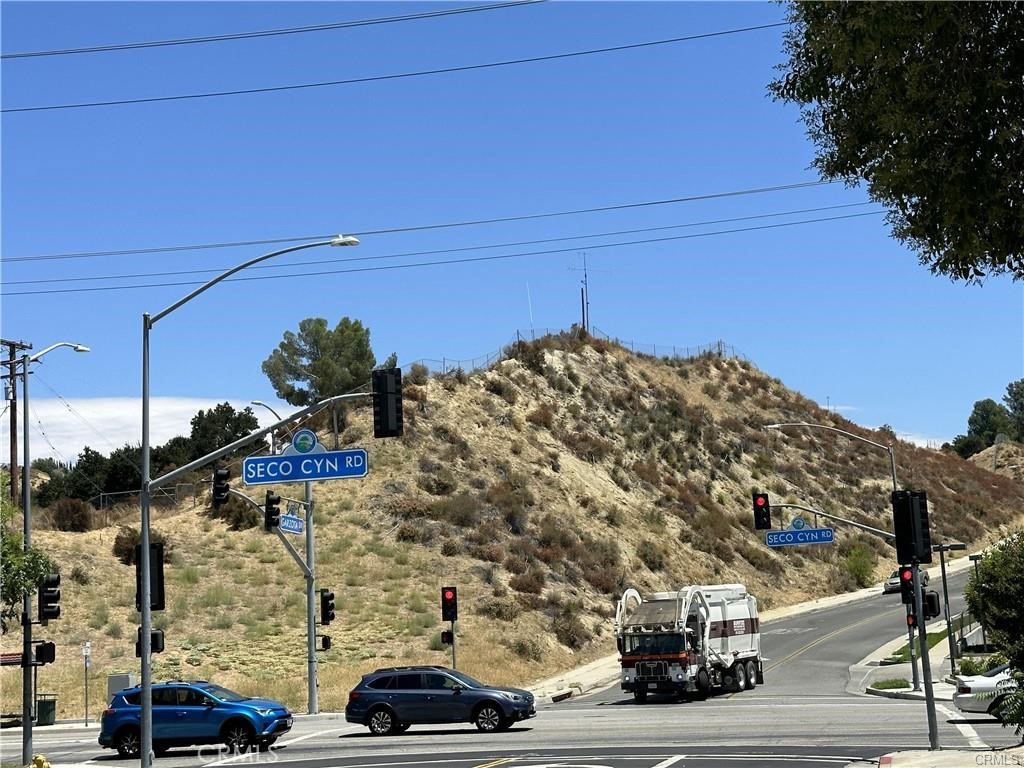 a view of a city street with tall buildings