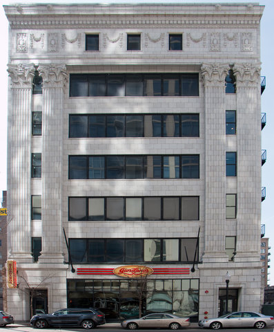 a front view of a building with a bunch of windows