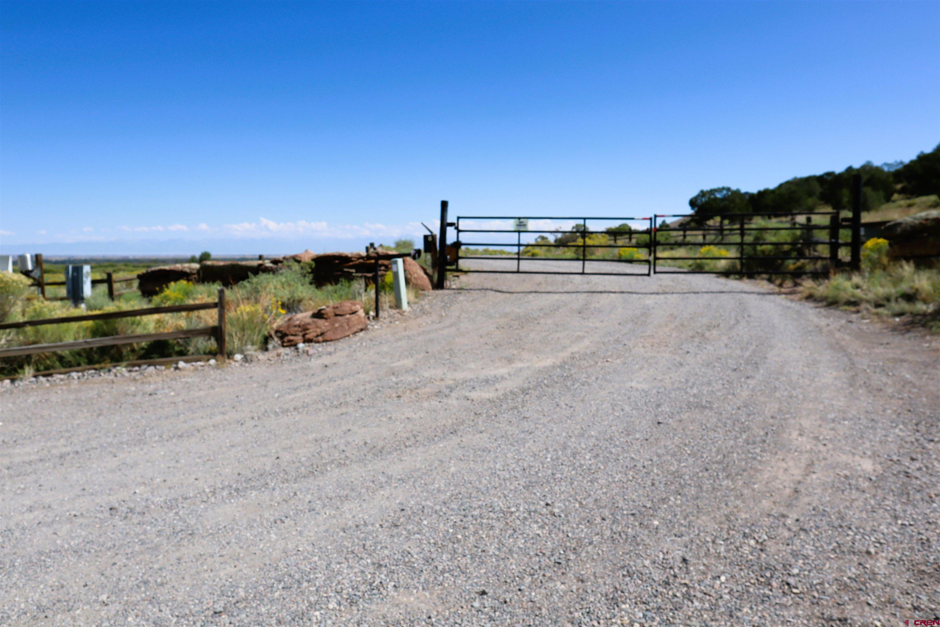 a view of a road with lawn chairs