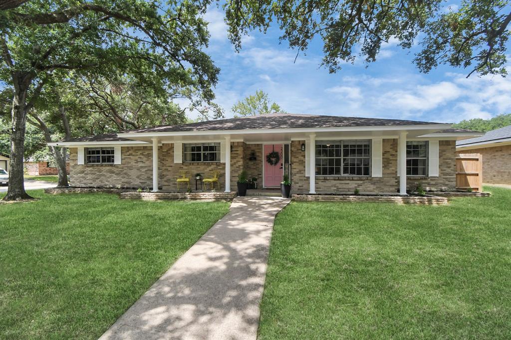 Durable 4-sided brick facade, complemented by a welcoming covered porch and an attached garage for added convenience.