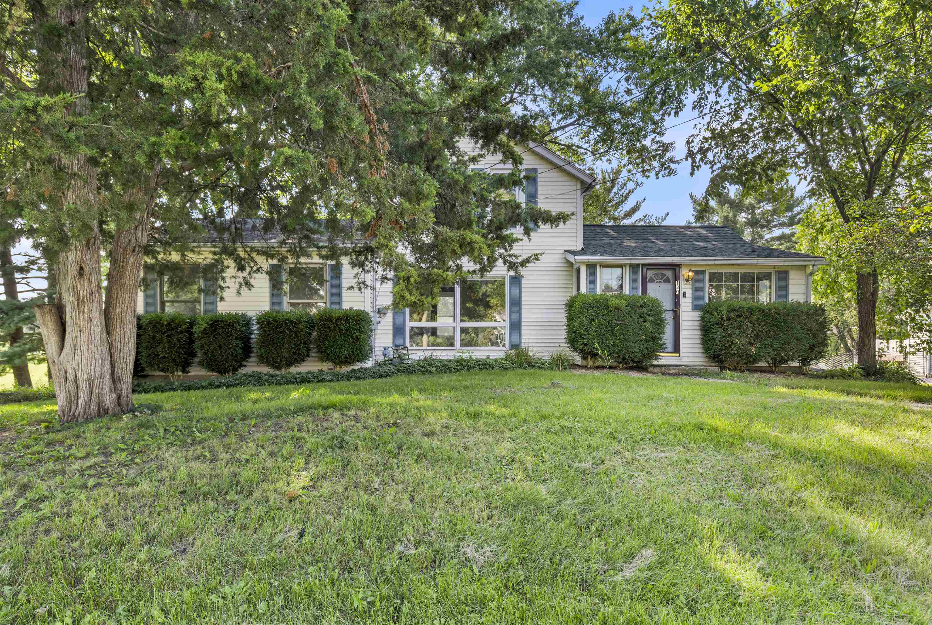 front view of a house with a big yard