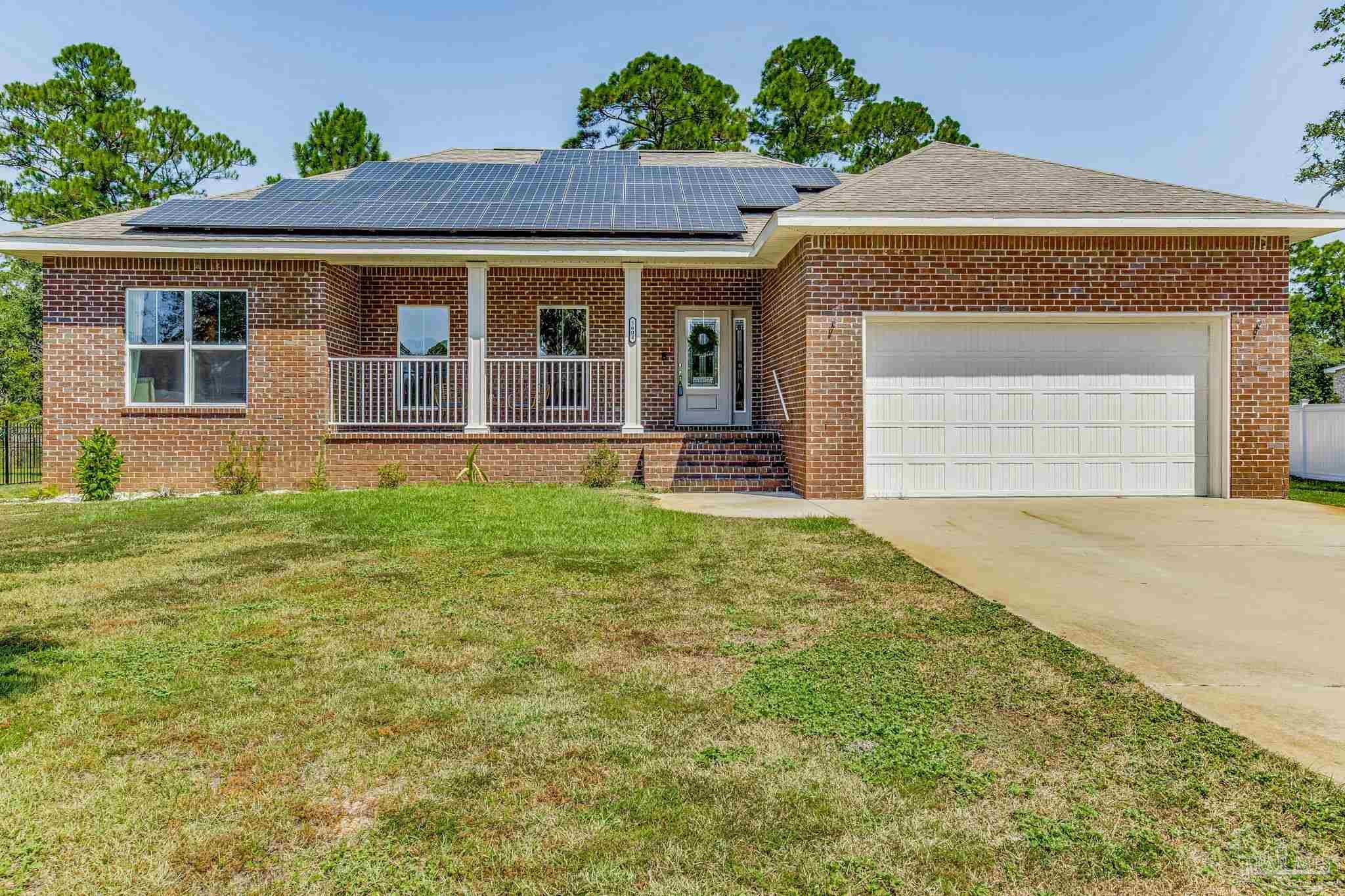 front view of a house with a yard