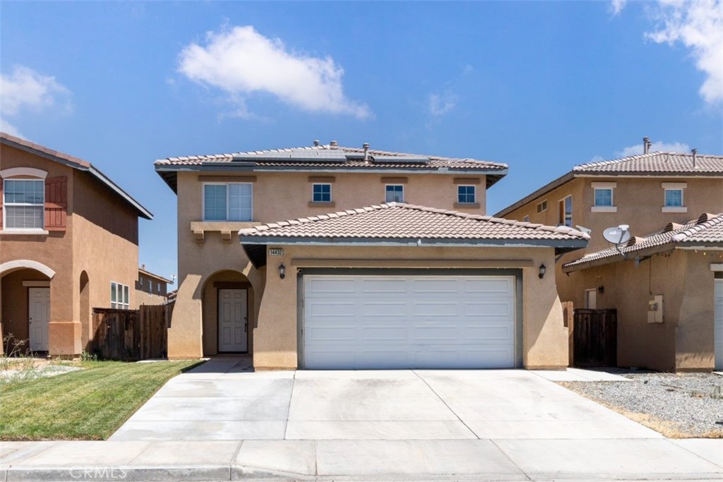 a front view of a house with a garage