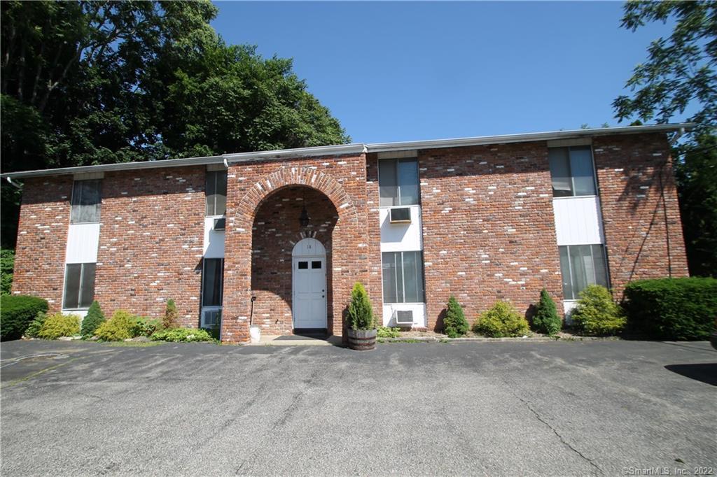 a front view of a house with parking