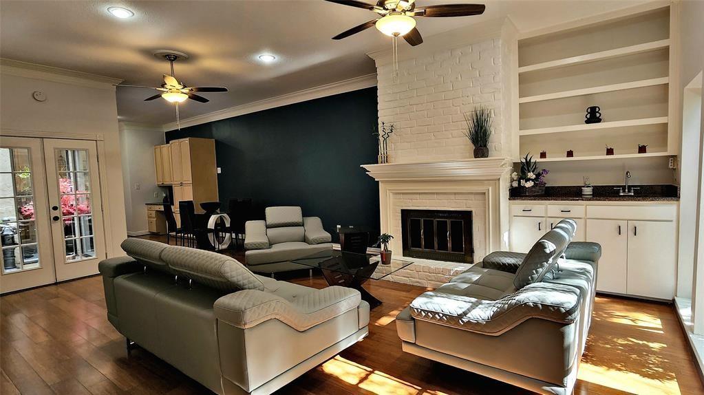 a living room with furniture fireplace and flat screen tv