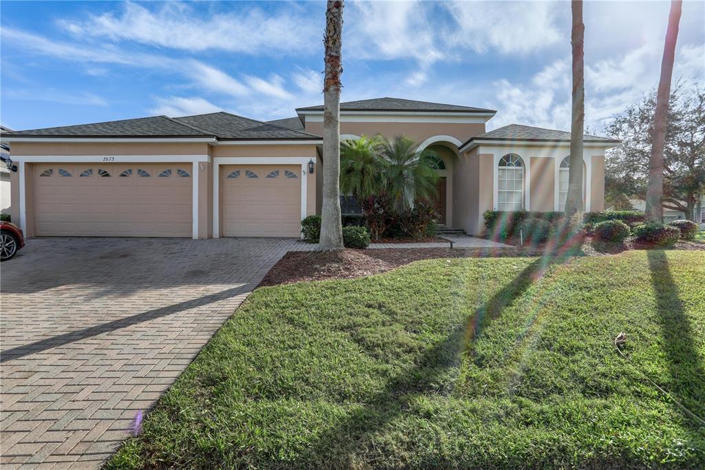 front view of a house with a yard