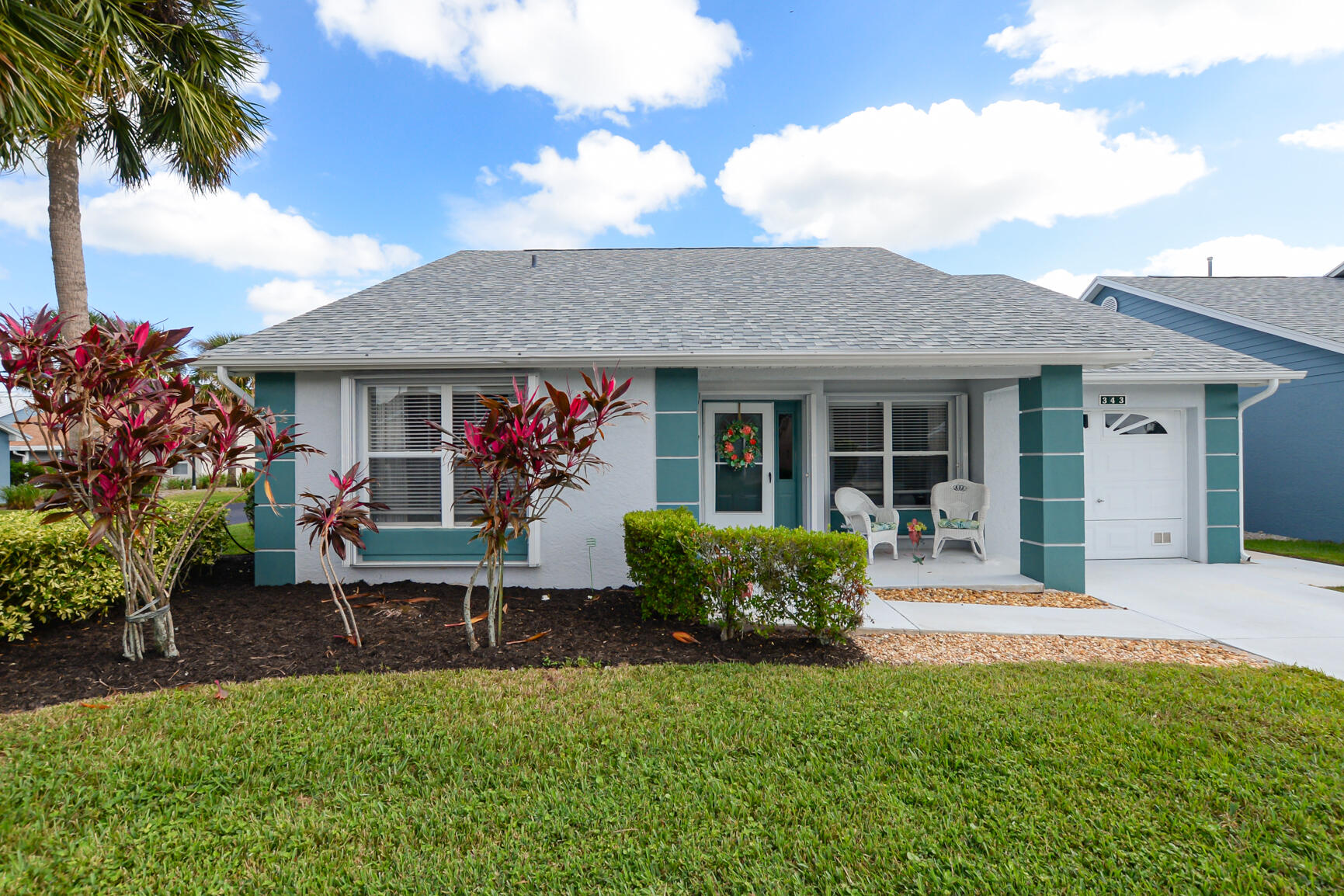 front view of a house with a yard