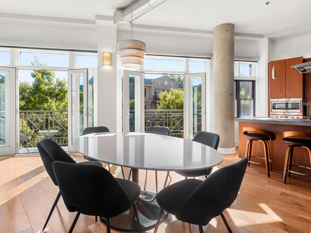 a view of a dining room with furniture window and outside view