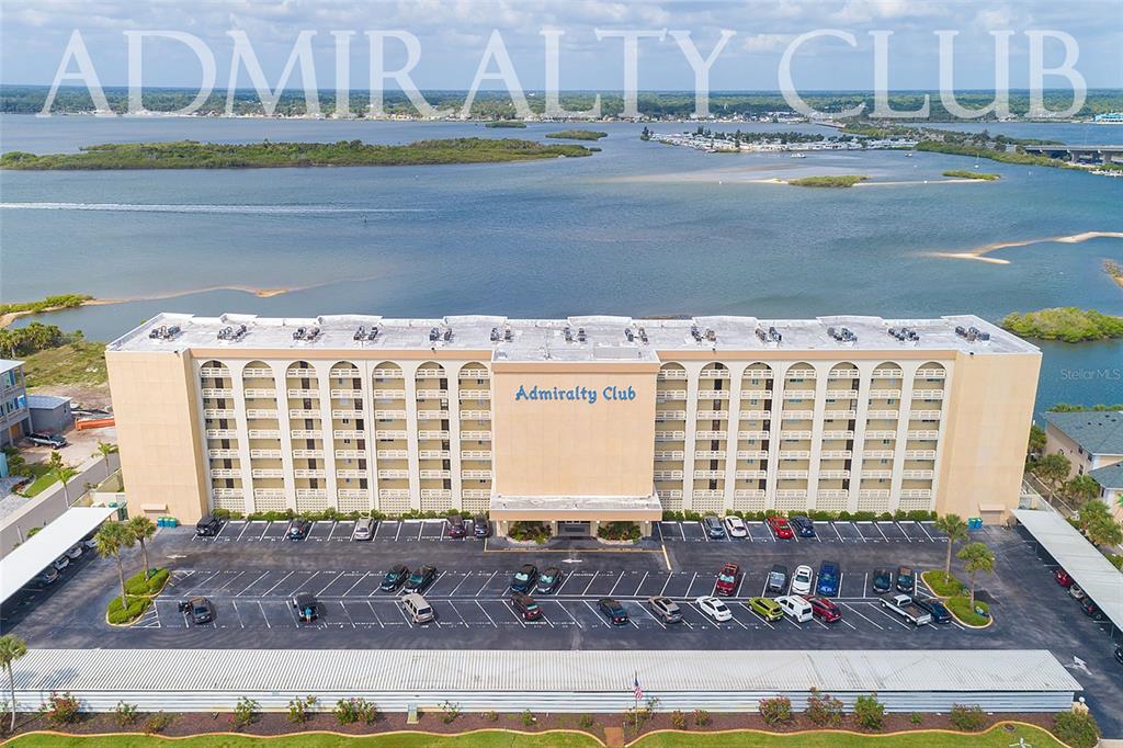 a view of a large building and pool