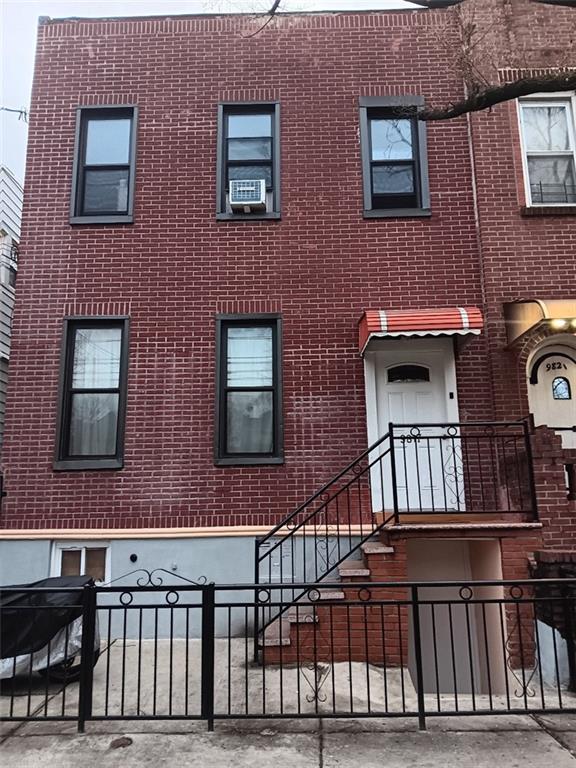 a view of brick house with a window