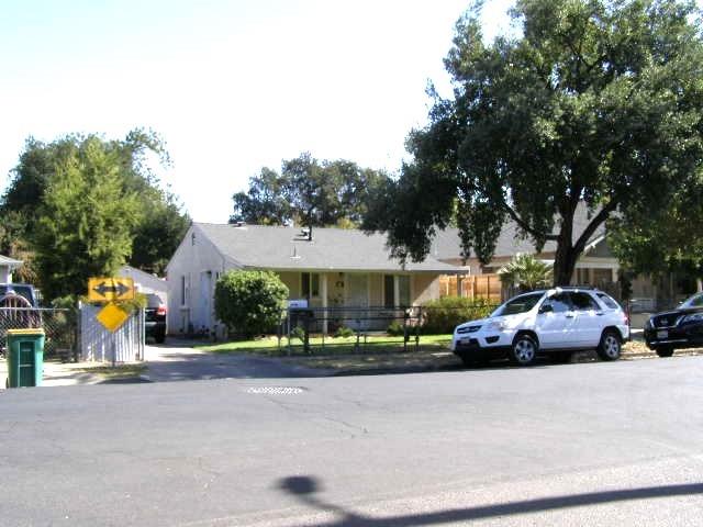 a view of street with parked cars