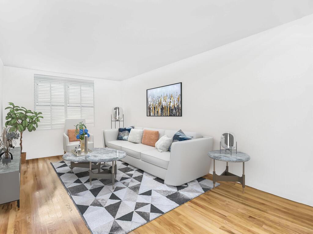 a living room with furniture and a potted plant