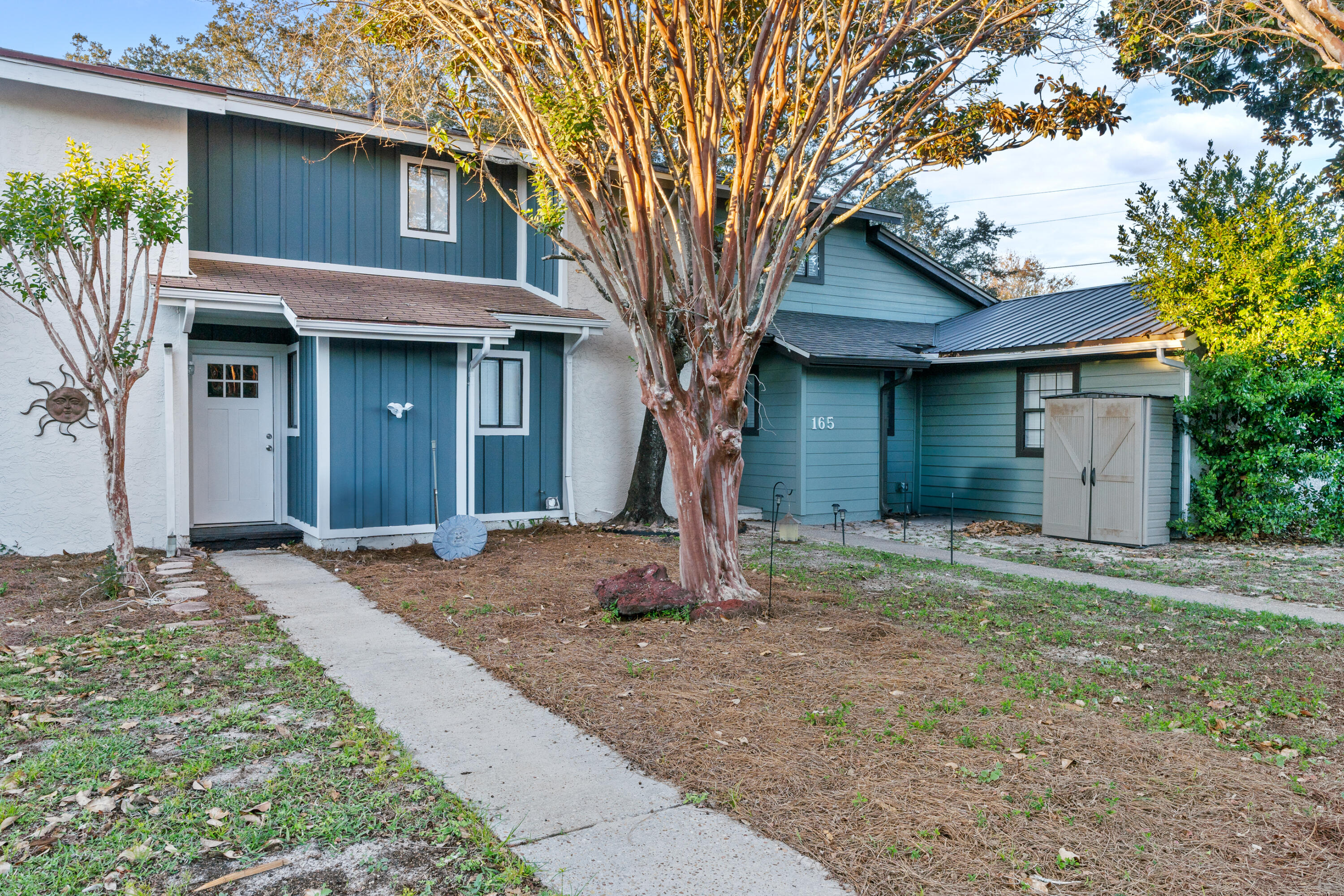 a front view of a house with garden