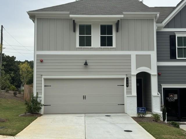 a front view of a house with garage