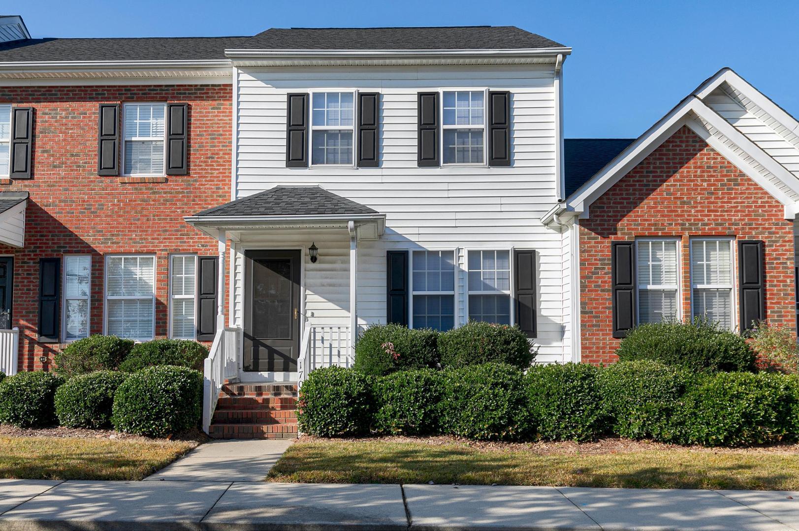 a front view of a house having yard