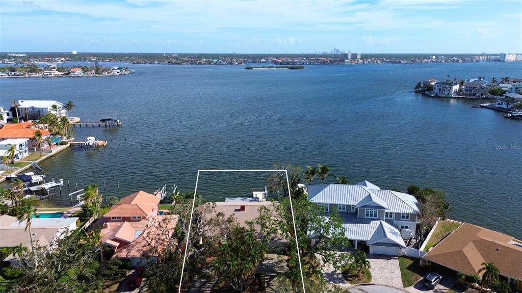 an aerial view of a house with a lake view