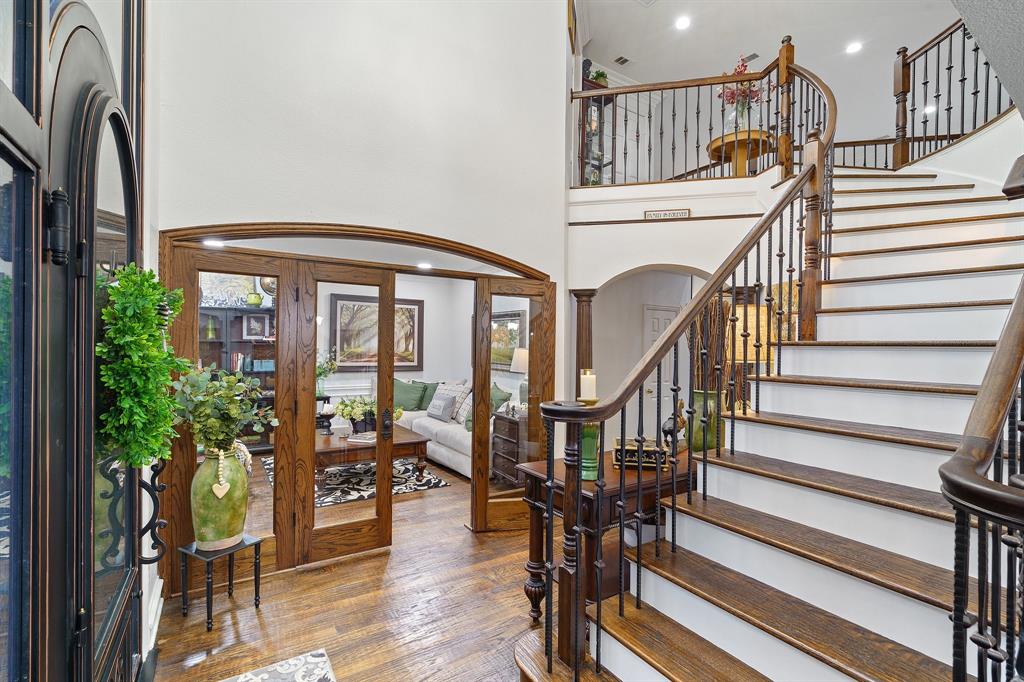 a view of entryway livingroom and hall with wooden floor