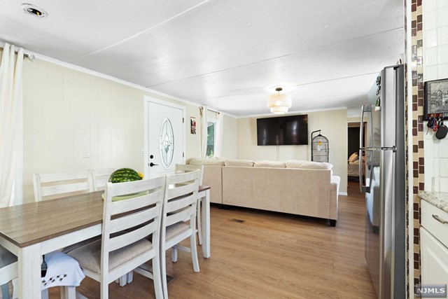 a living room with a flat screen tv and a table