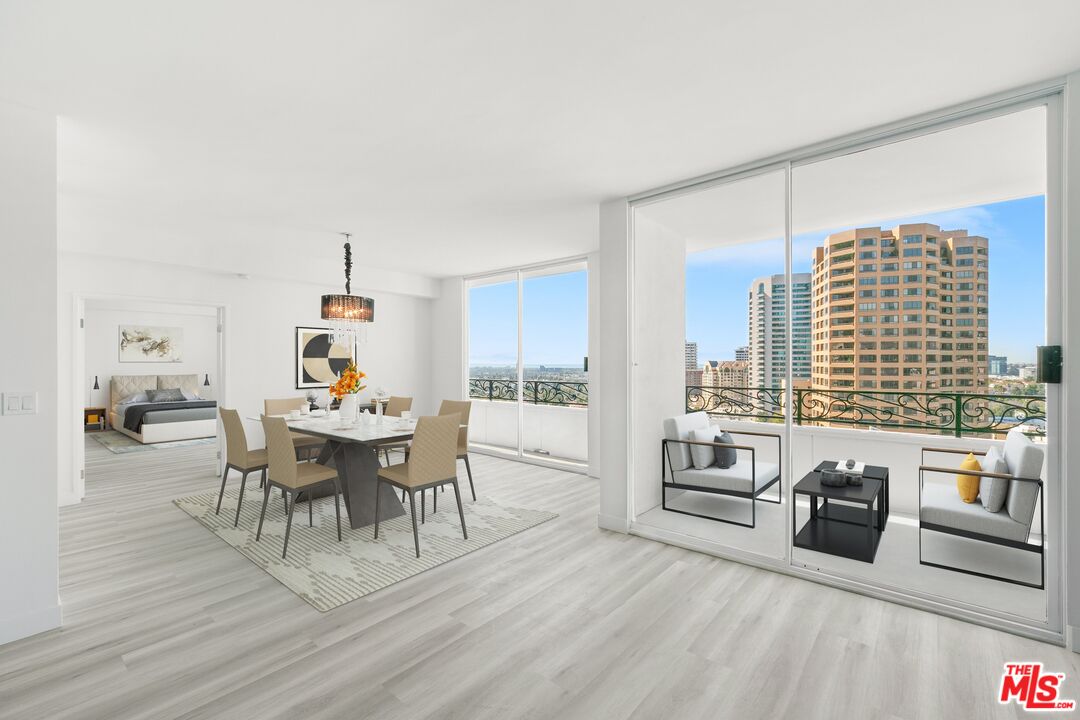 a view of a dining room with furniture and a wooden floor