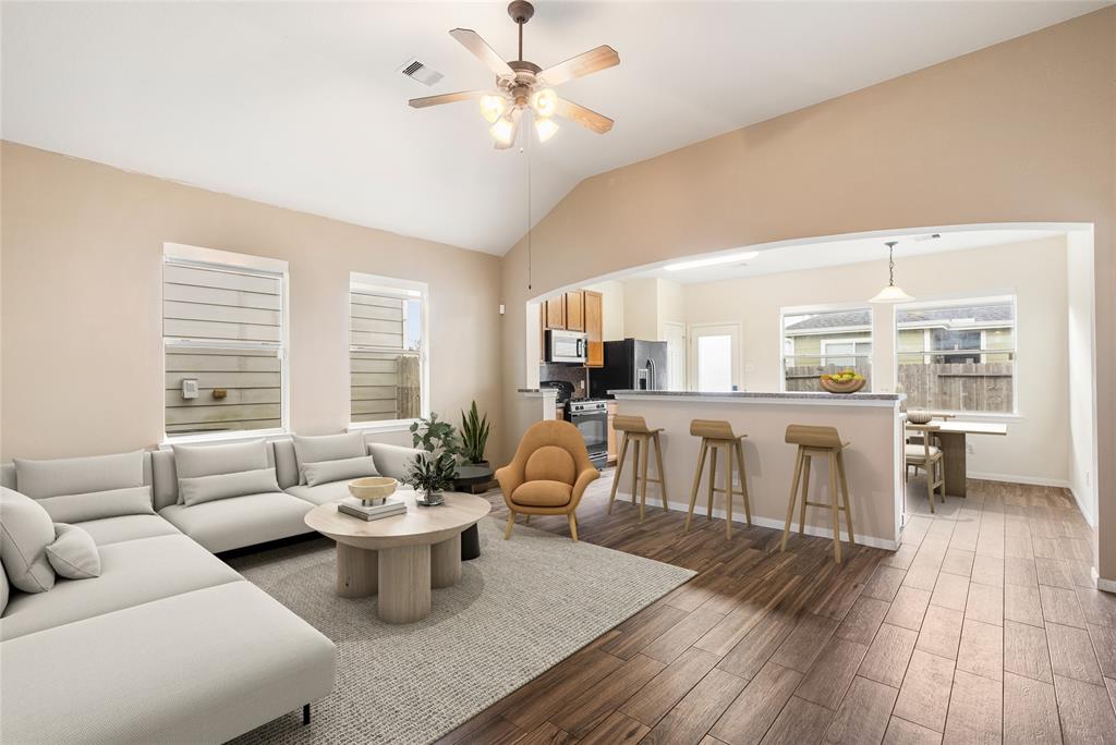 a living room with furniture and a large window