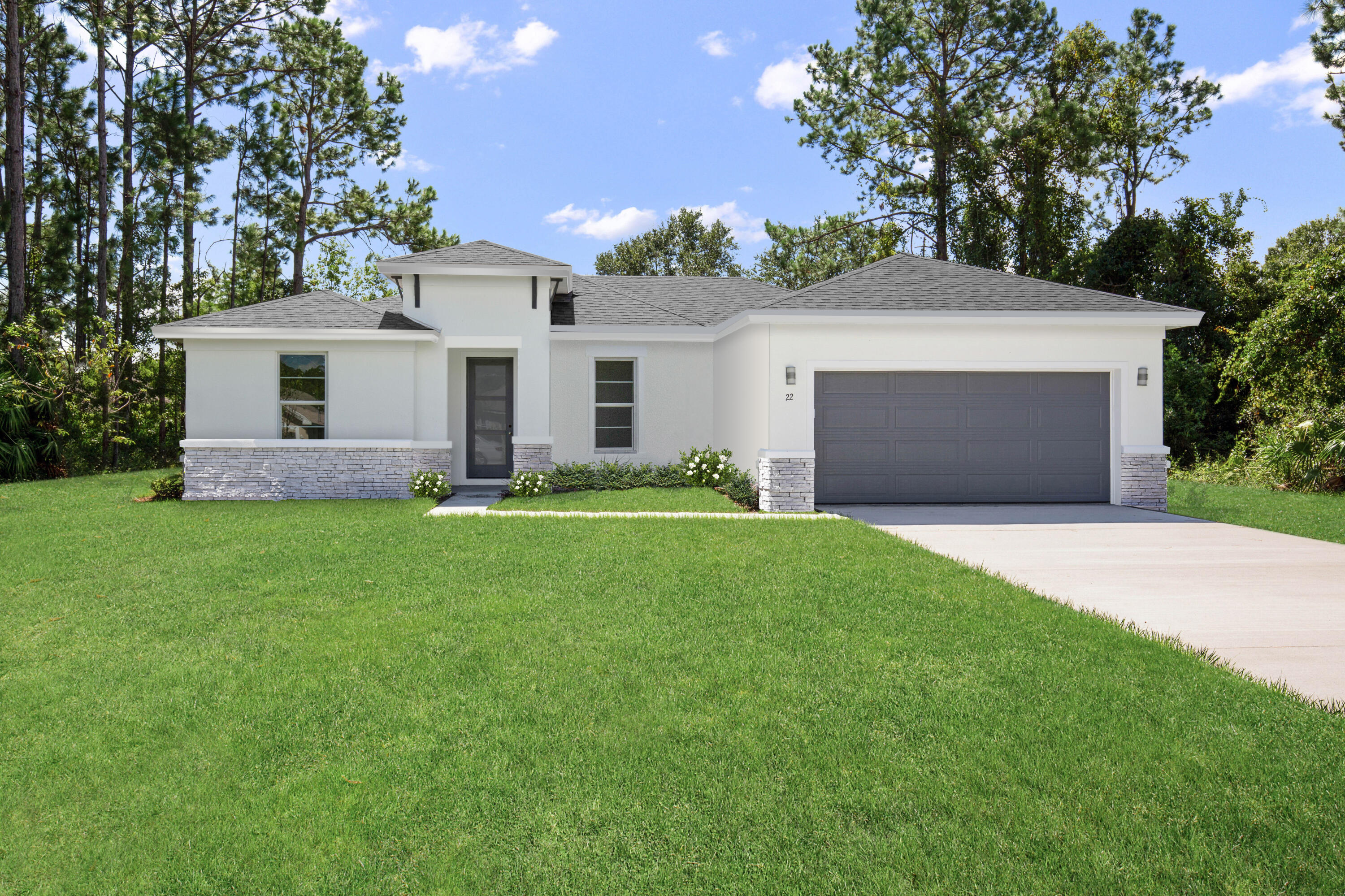 a front view of house with yard and green space