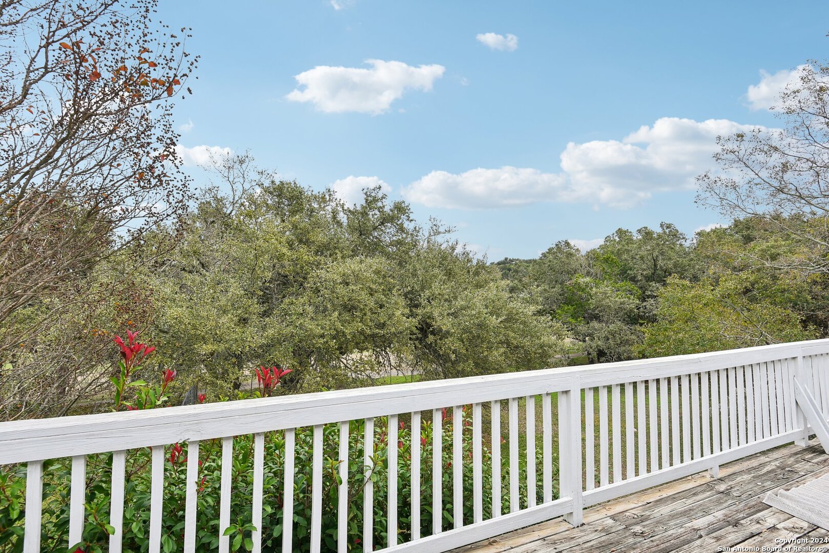 a balcony with an outdoor space