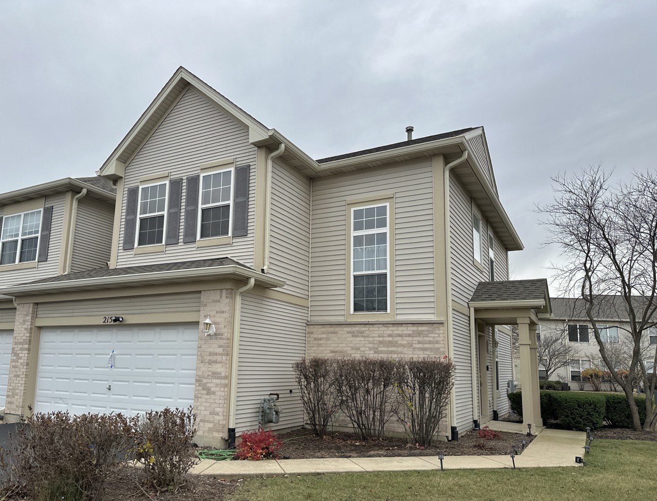 a front view of a house with yard