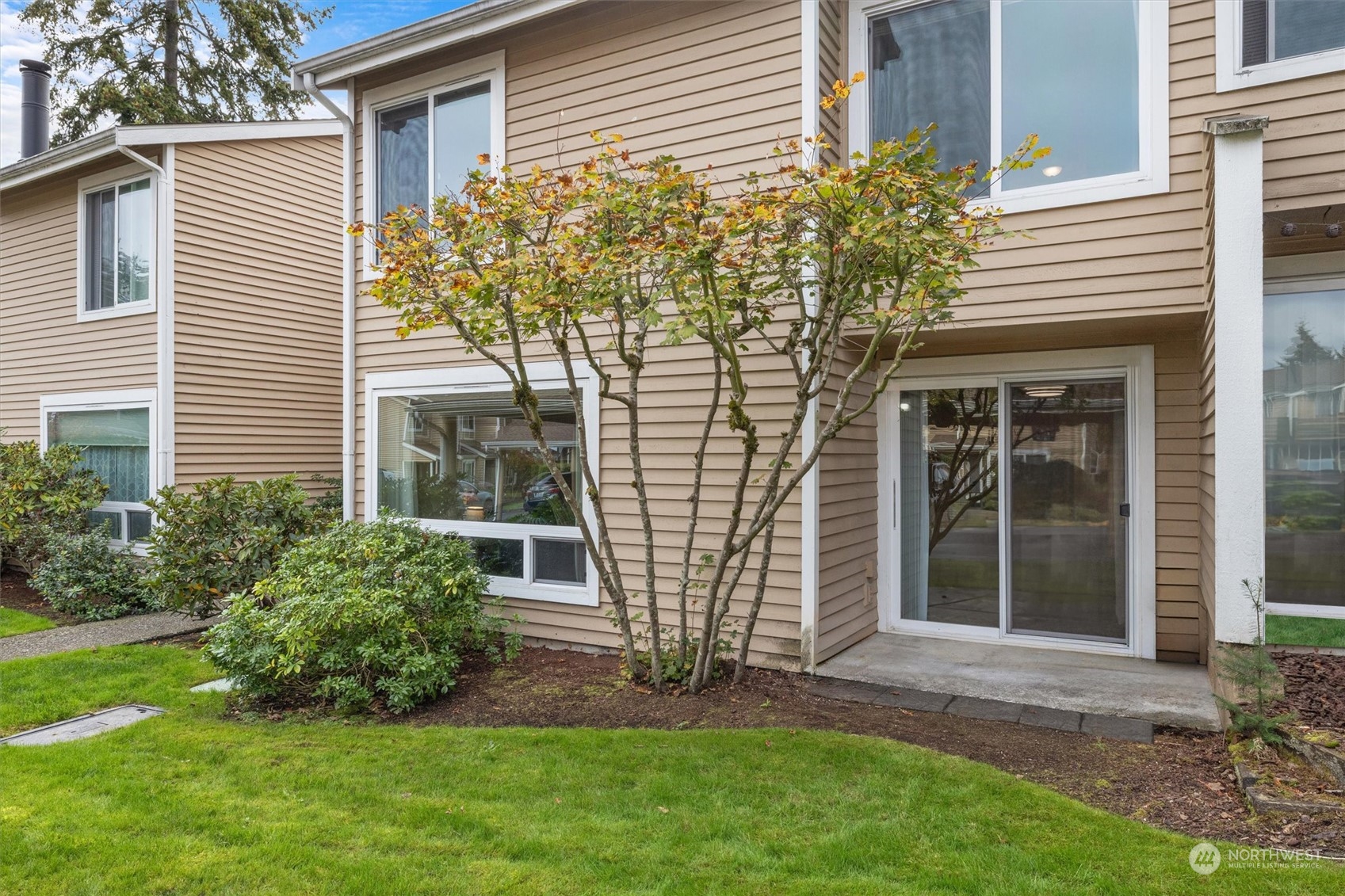 front view of a house with a yard